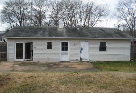 before picture of house fix and flip rear view