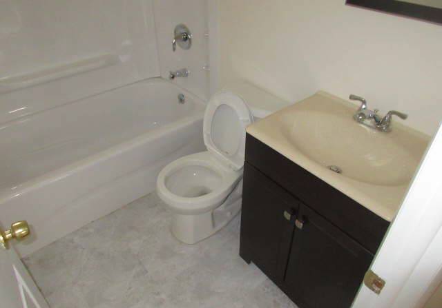 Bathroom before renovations funded by DE private lender